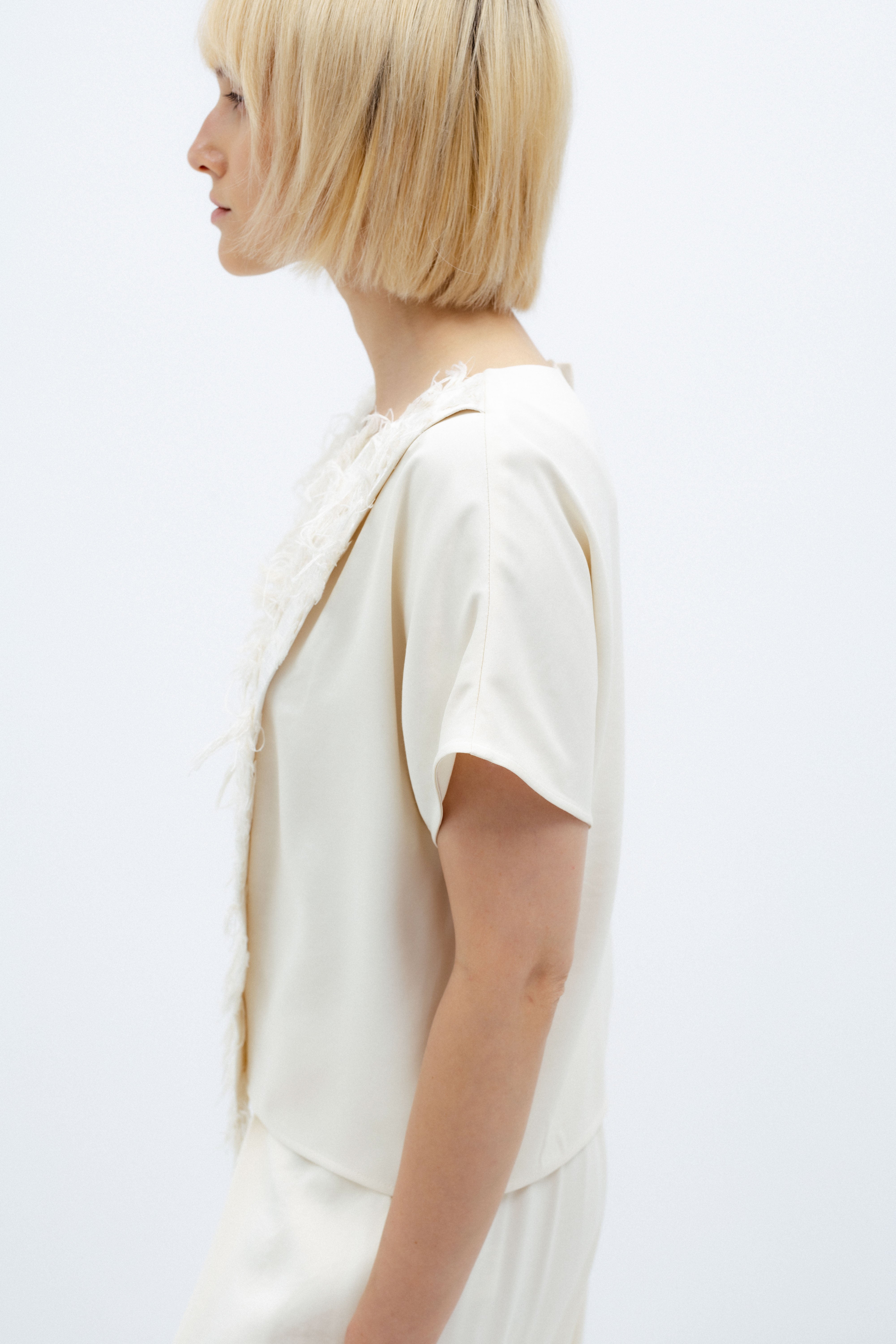 MILK-SHADE BLOUSE WITH ASYMMETRICAL APPLIQUE