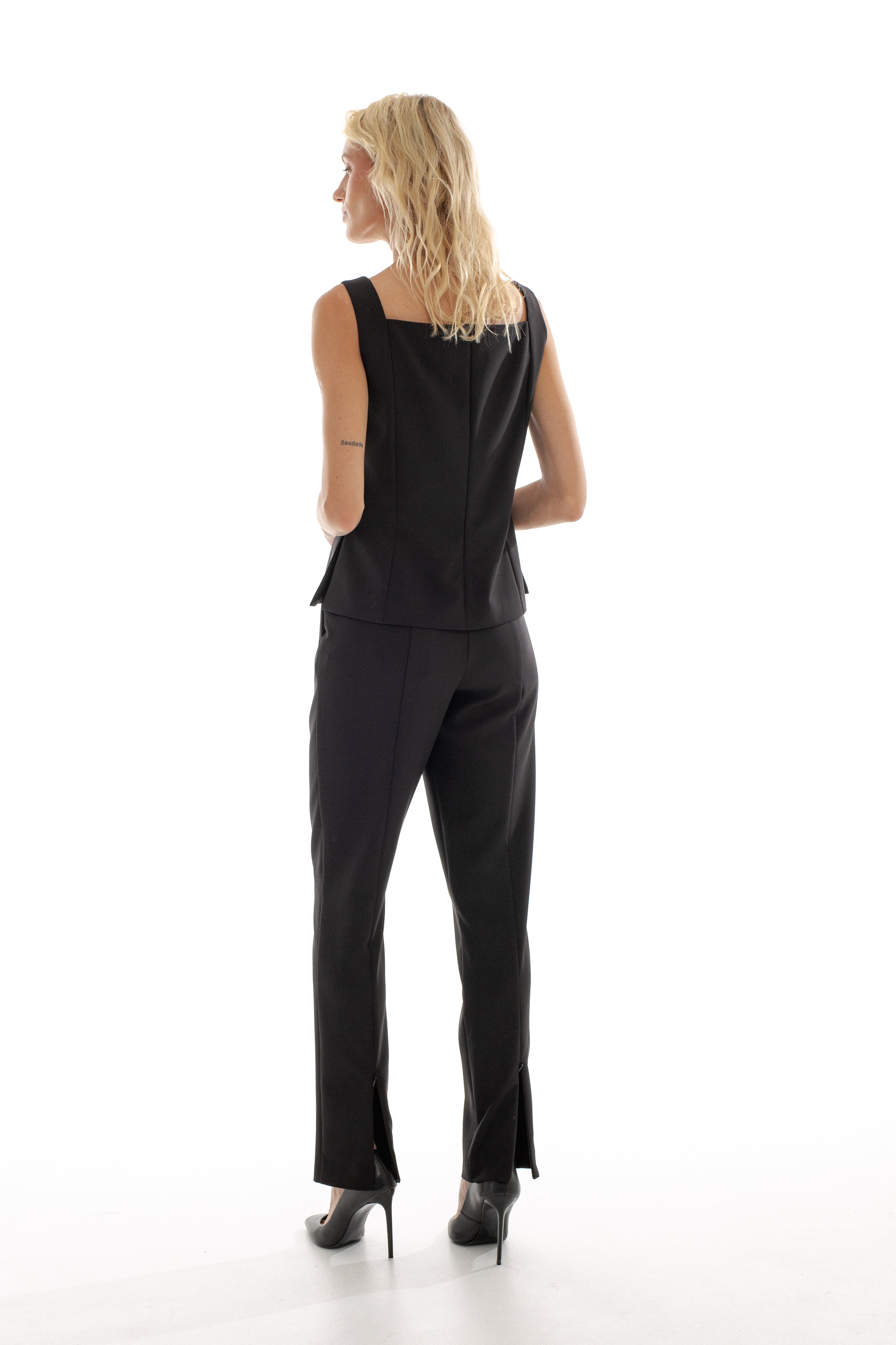 TROUSERS WITH HIDDEN ZIPPERS AT THE BACK HEM