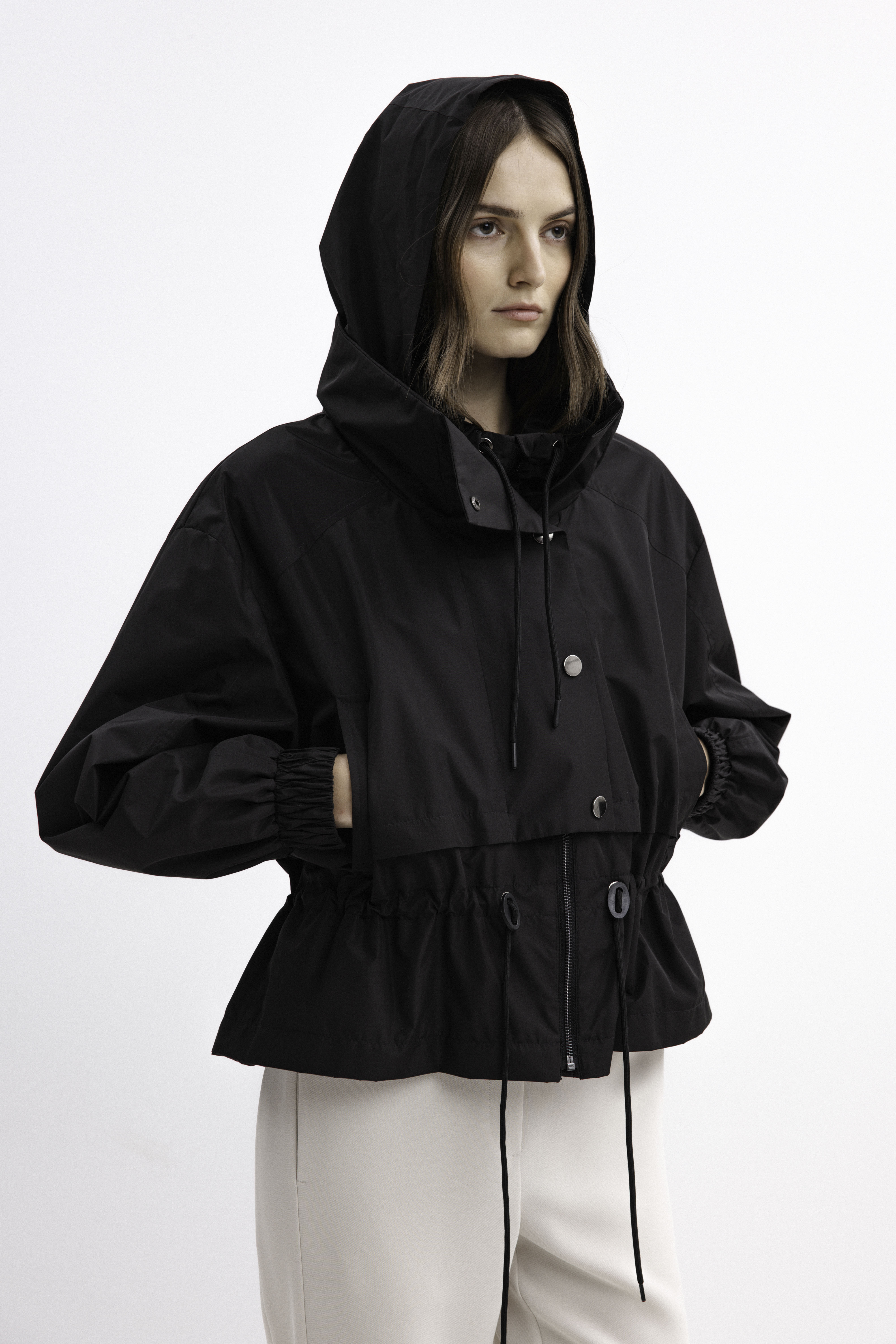 BLACK SHORT RAINCOAT WITH HOOD