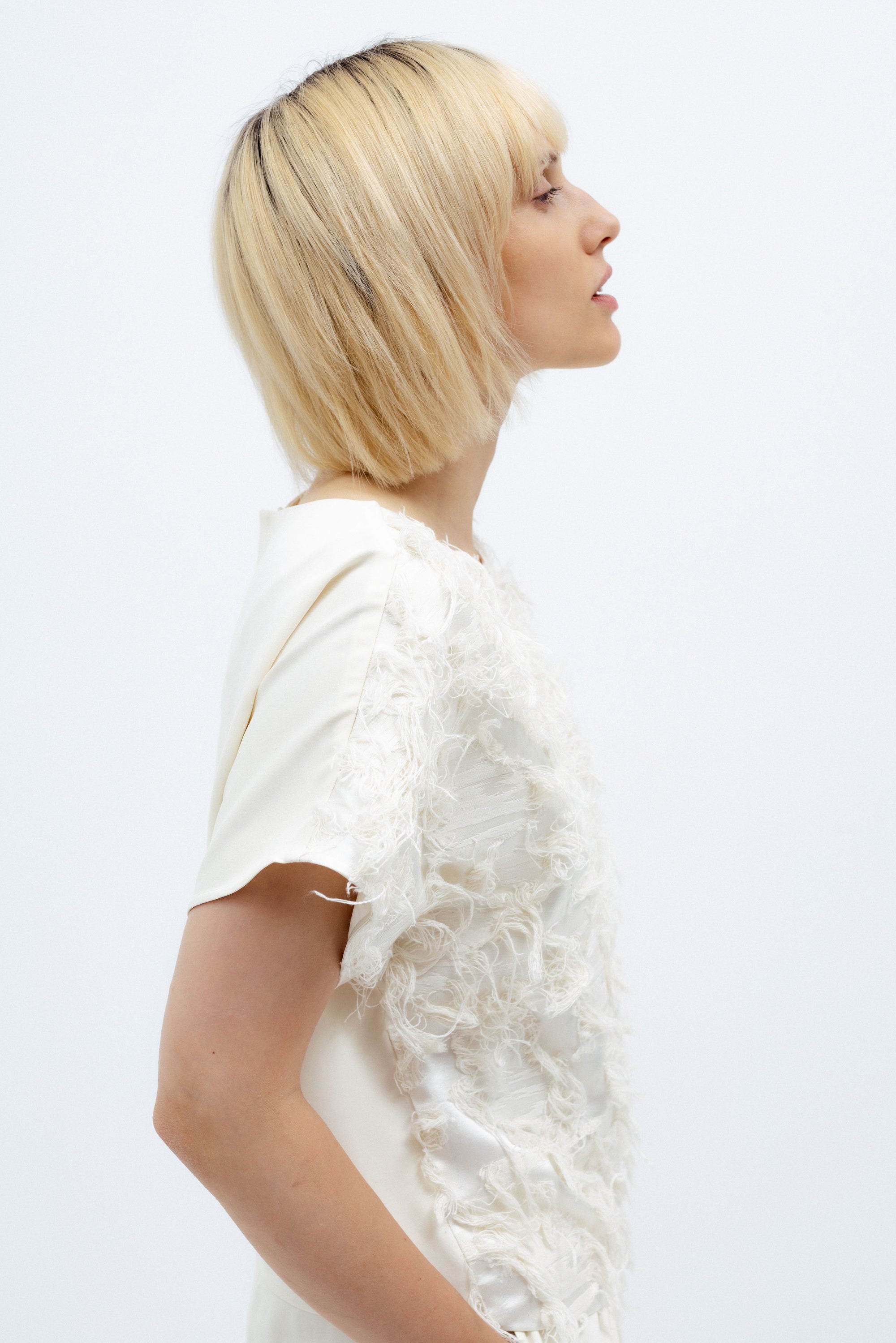 MILK-SHADE BLOUSE WITH ASYMMETRICAL APPLIQUE