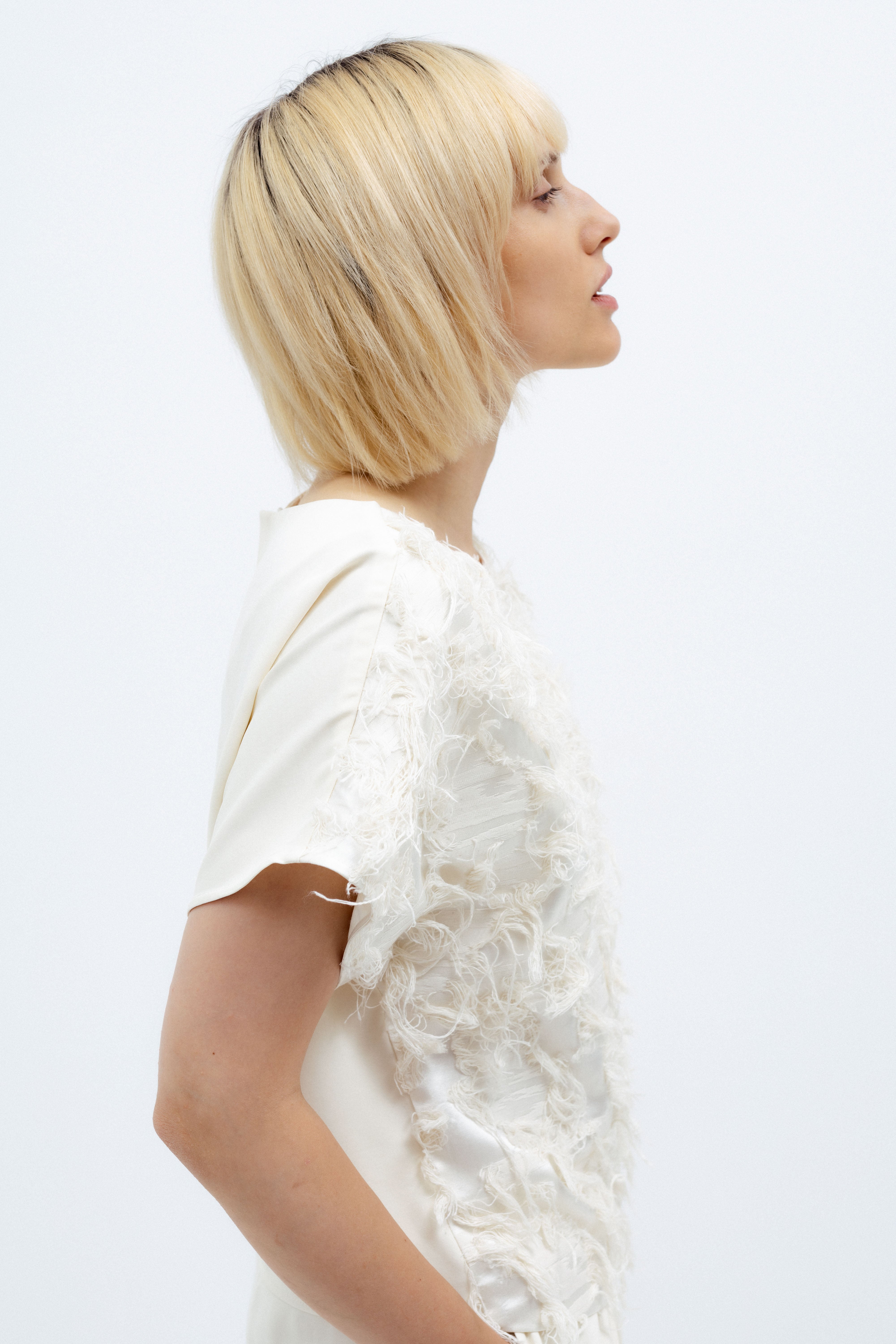 MILK-SHADE BLOUSE WITH ASYMMETRICAL APPLIQUE