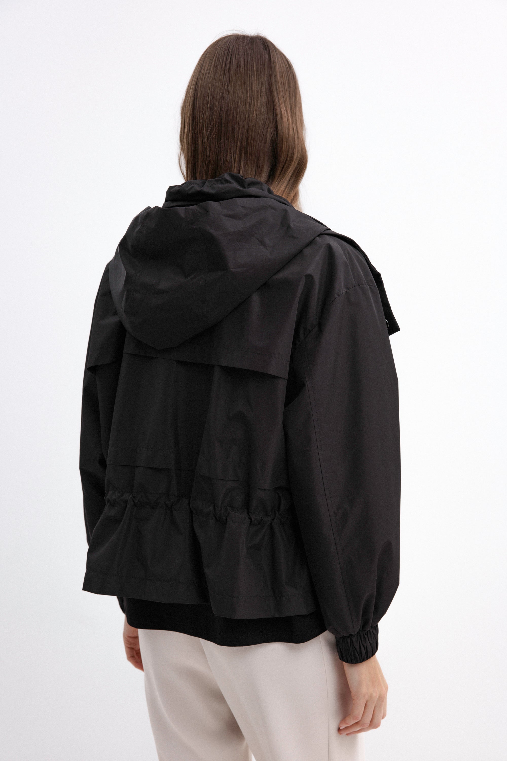 BLACK SHORT RAINCOAT WITH HOOD